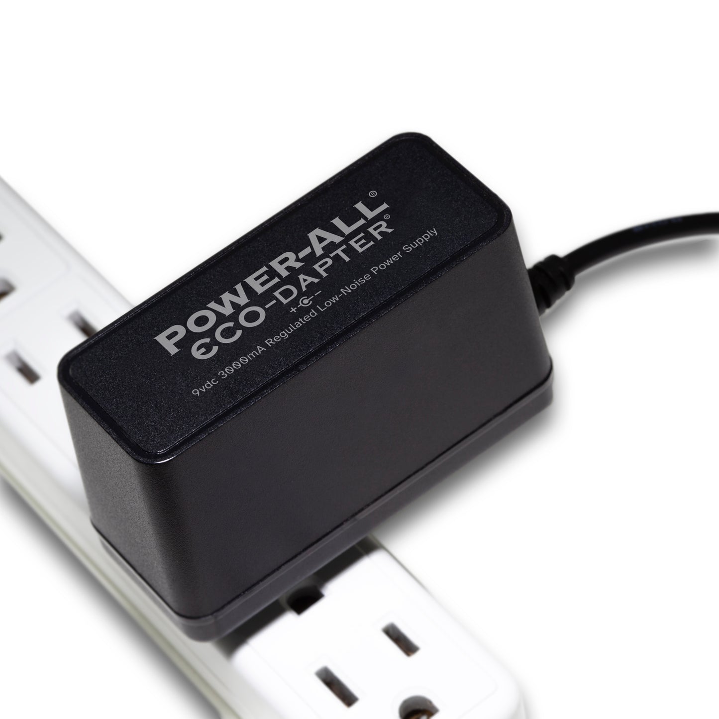 Power-All ECO-Dapter 3000mA 9vdc Power Supply for Guitar Effect Pedals plugged into one spot on a power strip