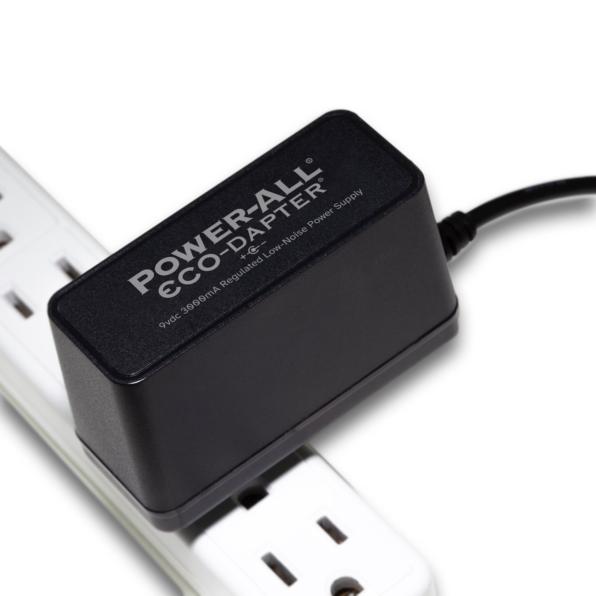 Power-All ECO-Dapter 3000mA 9vdc Power Supply for Guitar Effect Pedals plugged into one spot on a power strip